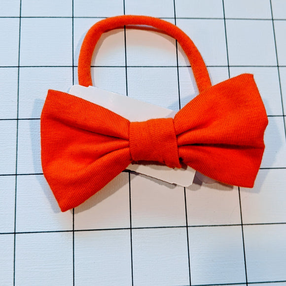 Buckle on small orange soft nylon headband