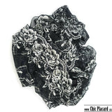Dentelle noire aux fleurs argentées 23,5 cm (vendu au 1/2m)